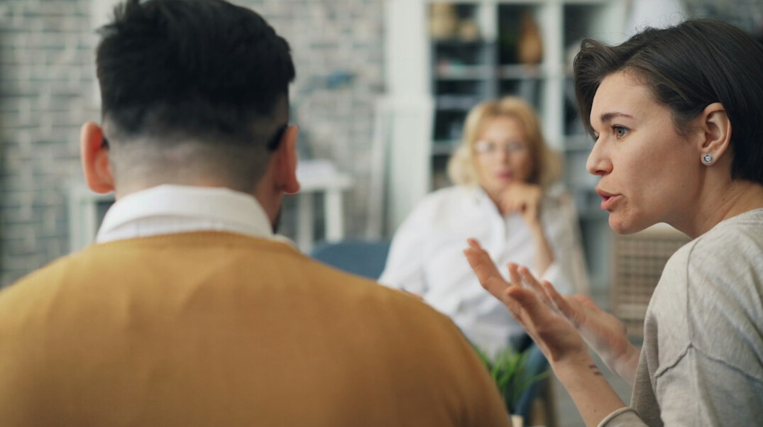 woman gesturing during conversation