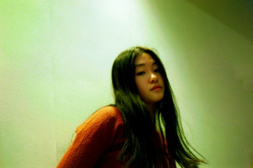 Portrait of a young woman with long dark hair