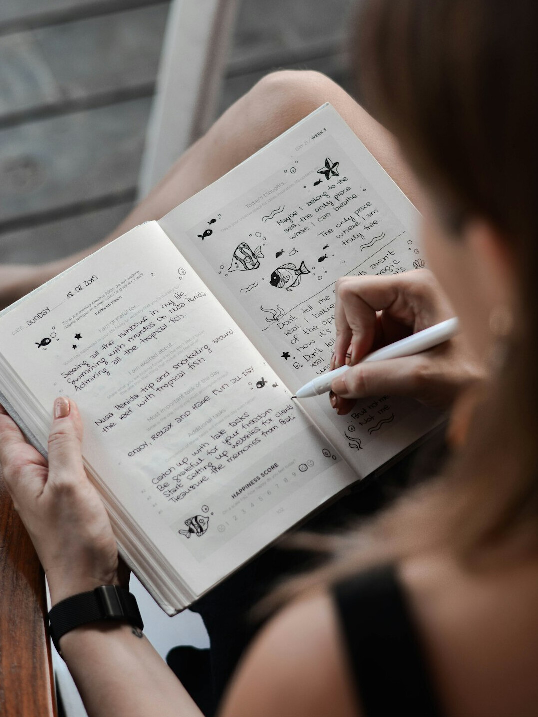 woman writing in journal